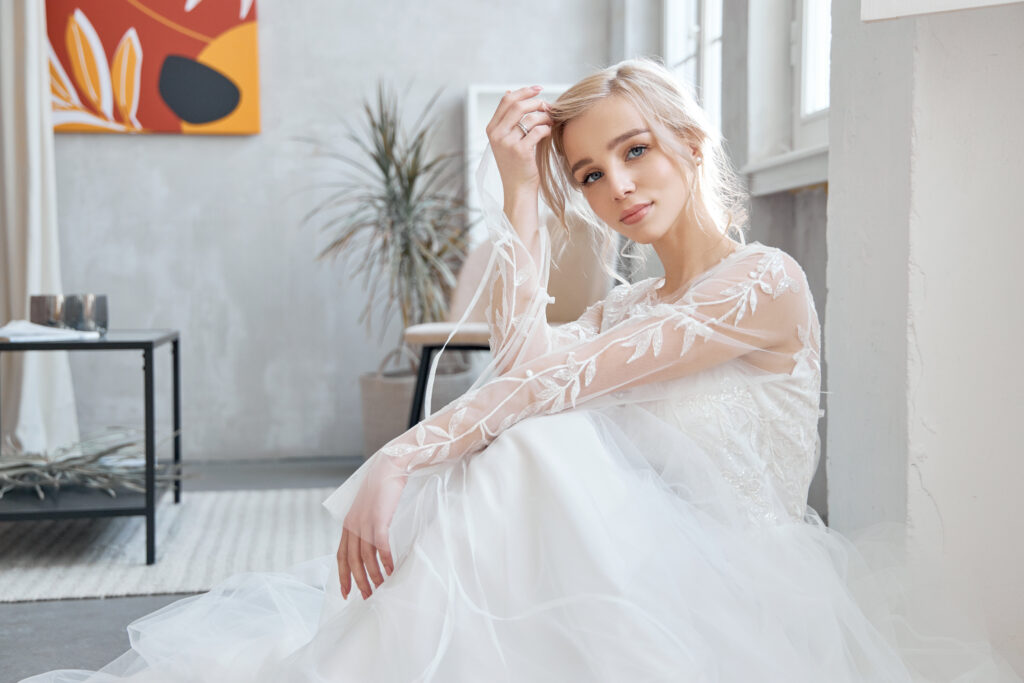 bride sitting on the floor in her wedding dress