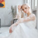 bride sitting on the floor in her wedding dress