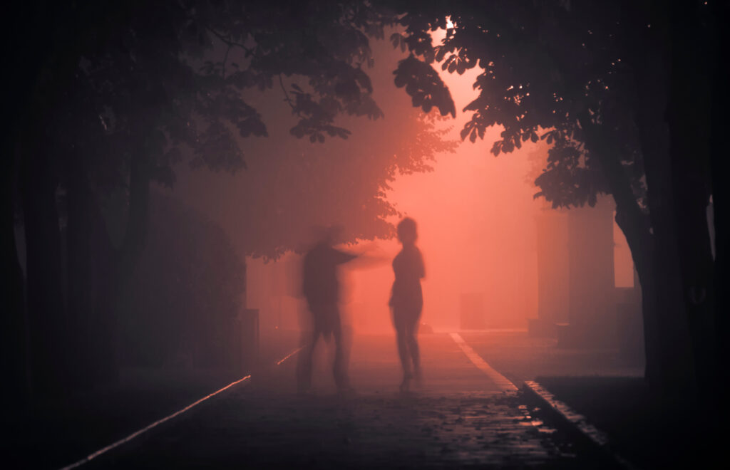 A maniac on a foggy street at night attacks a passerby.