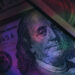 Close up Franklin's face on a one hundred dollar. American, US Dollars Cash Money background.