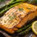 salmon with asparagus and lemon slices on a cutting board