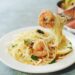 Homecooked Shrimp Scampi with Spaghetti pasta and lemon, selective focus