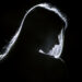 sad woman profile silhouette in dark